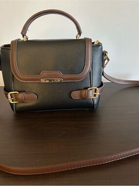 Chic Black Satchel with Brown Trim and Gold Accent